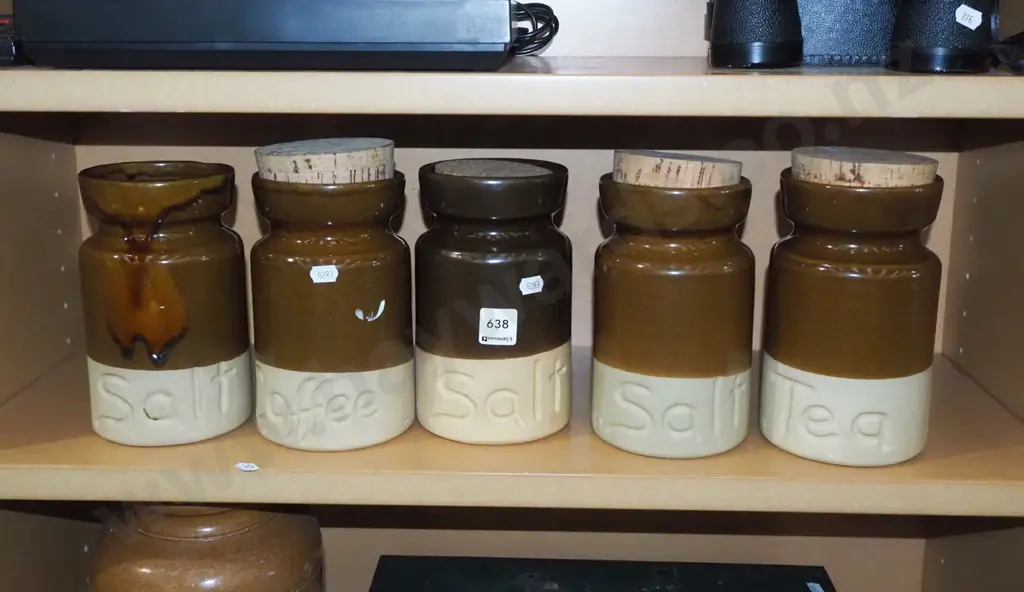 shelf of storage canisters- 1 missing lid Image 1++