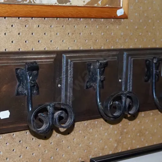 3x coat hooks on board