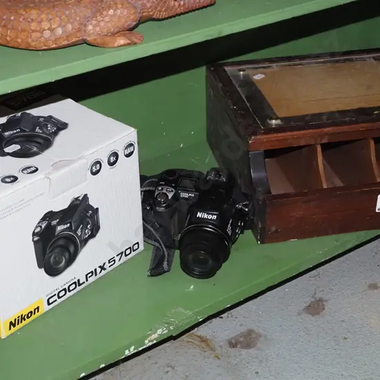 Nikon Coolpix 5700 digital camera, cigarette packet dispenser