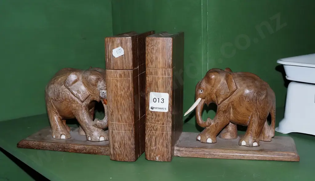 pair of carved wooden elephant bookends with secret compartments Image 1++