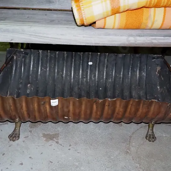 homemade wood basket made from brass claw feet and small half hot water cylinder