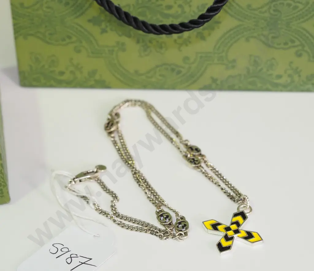 black and yellow cross pendant Image 1++