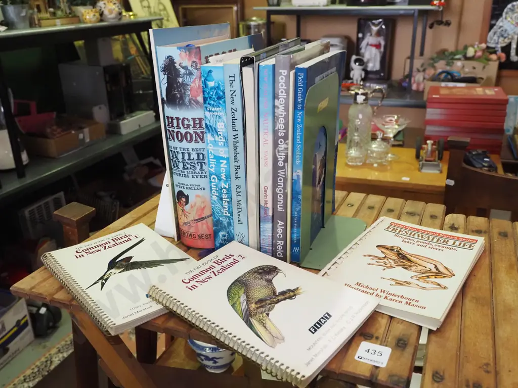 various books and metal bookends Image 1++