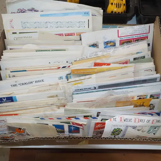 box of stamps, first day covers, envelopes