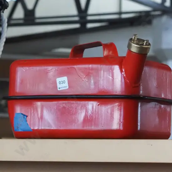 red painted brass cap petrol can