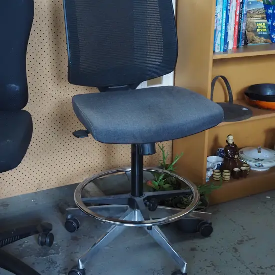black office chair with chrome foot rest