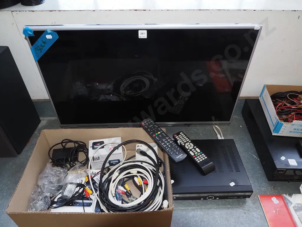 Panasonic TV with accessories and dish TV satellite box Image 1++