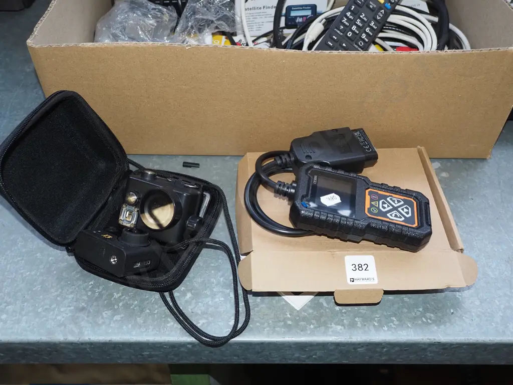 cased KB X3 action camera and a CY3001 fault diagnosis instrument with box Image 1++