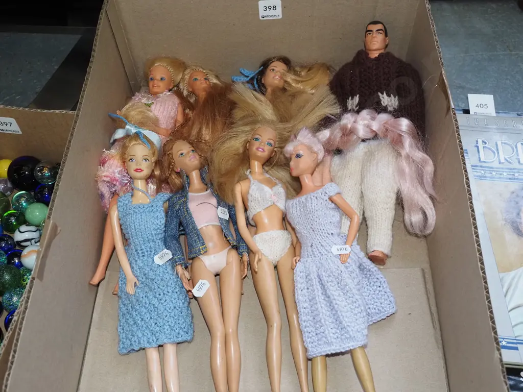 box of Barbie and other dolls Image 1++