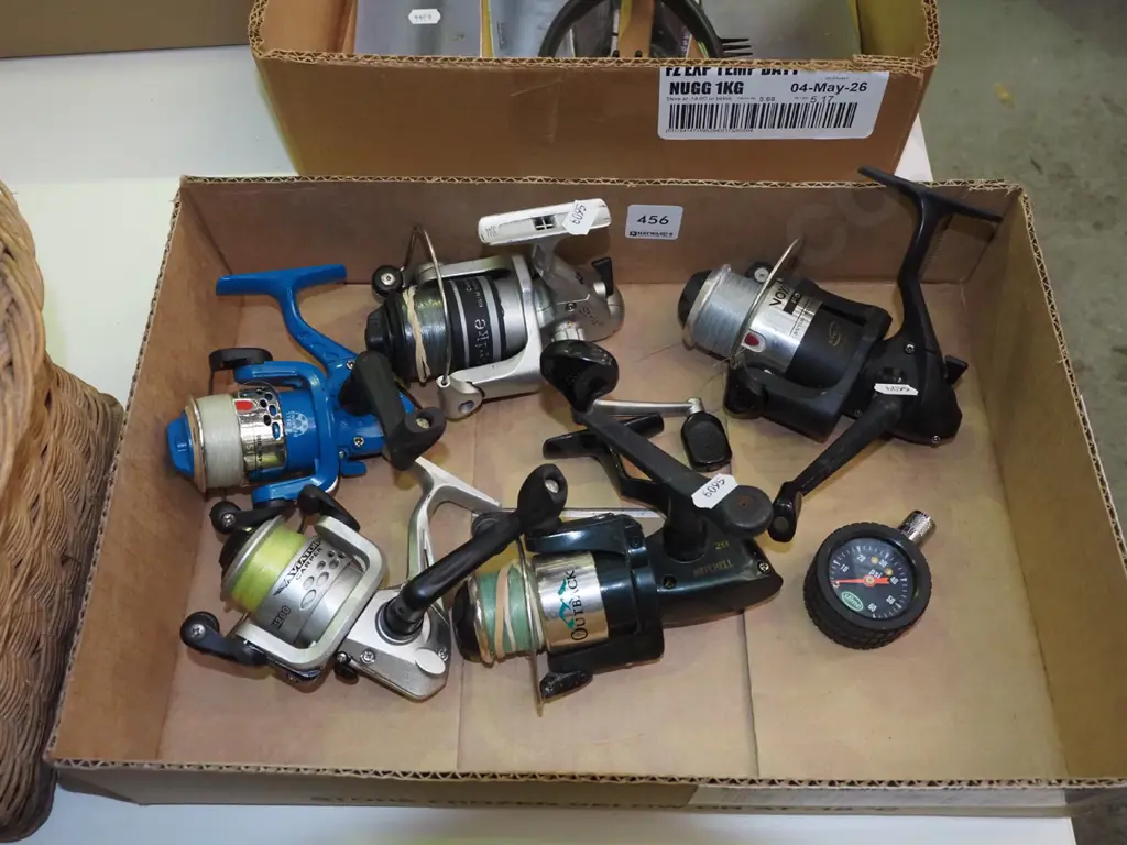 box; fishing reels and a tyre pressure gauge Image 1++