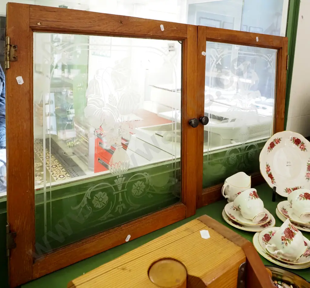 pair of glazed cupboard doors with floral etching and cast metal handles (small crack to 1 corner of one door) Image 1++