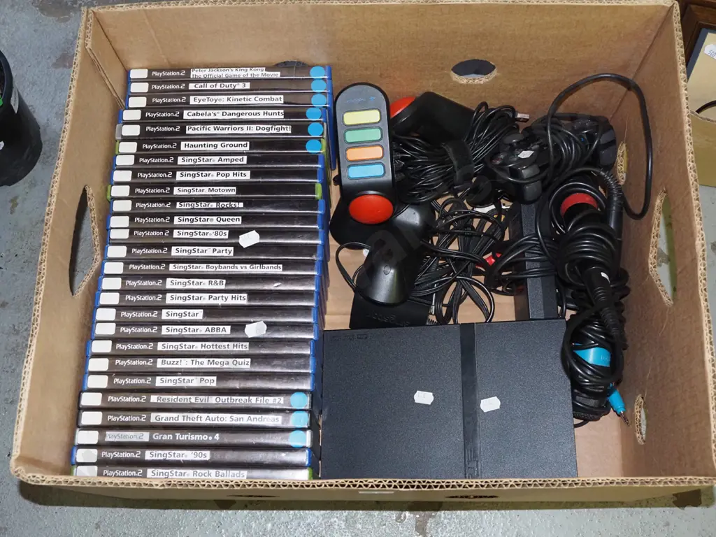 box; playstation 2 with controllers and games Image 1++
