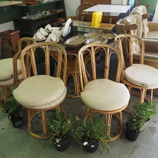 bamboo and glass top circular table with 4 matching swivel chairs and 6 cushions