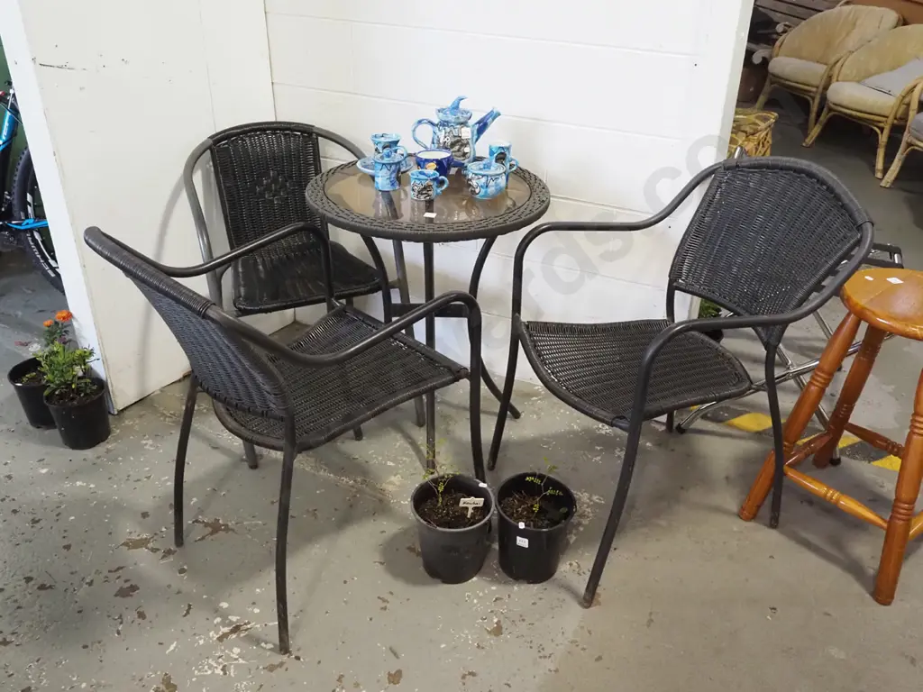 woven plastic and glass top patio table and 3 chairs Image 1++