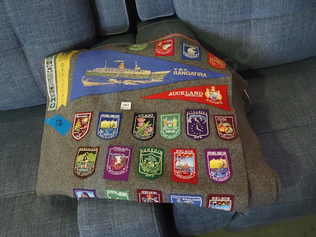 wollen blanket with various tourist badges and pendants Image 1++