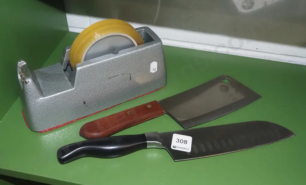 2 knives and a cellotape dispenser Image 1++