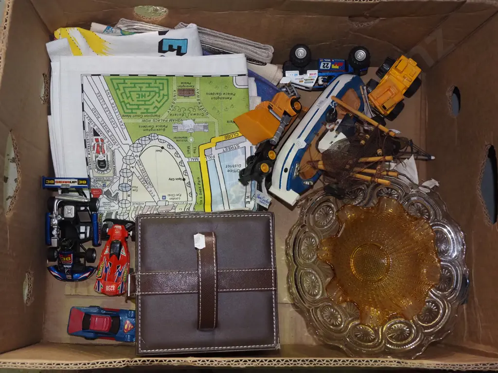 box of tea towels, model vehicles, glass comport, etc. Image 1++