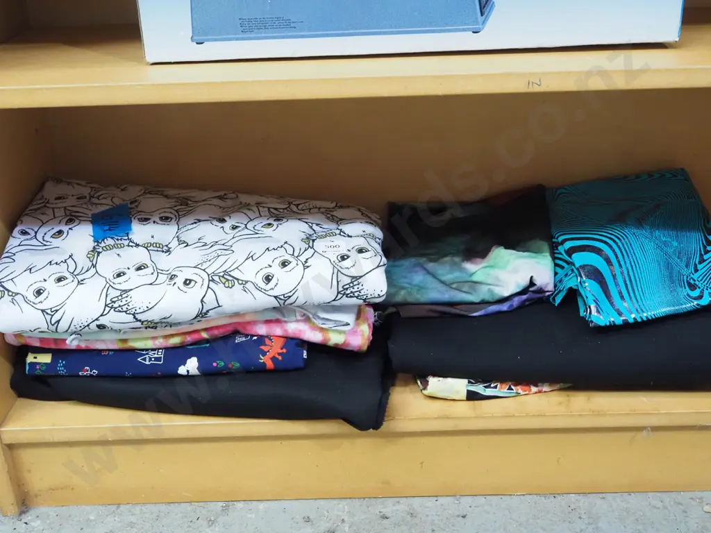 shelf of fabric pieces Image 1++