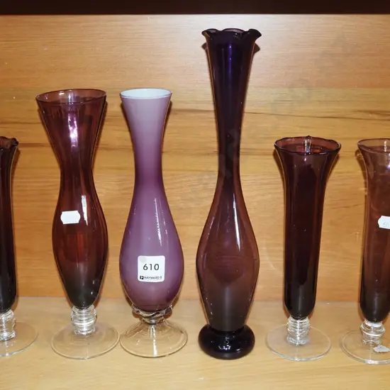 shelf of purple glass vases Tallest H-300