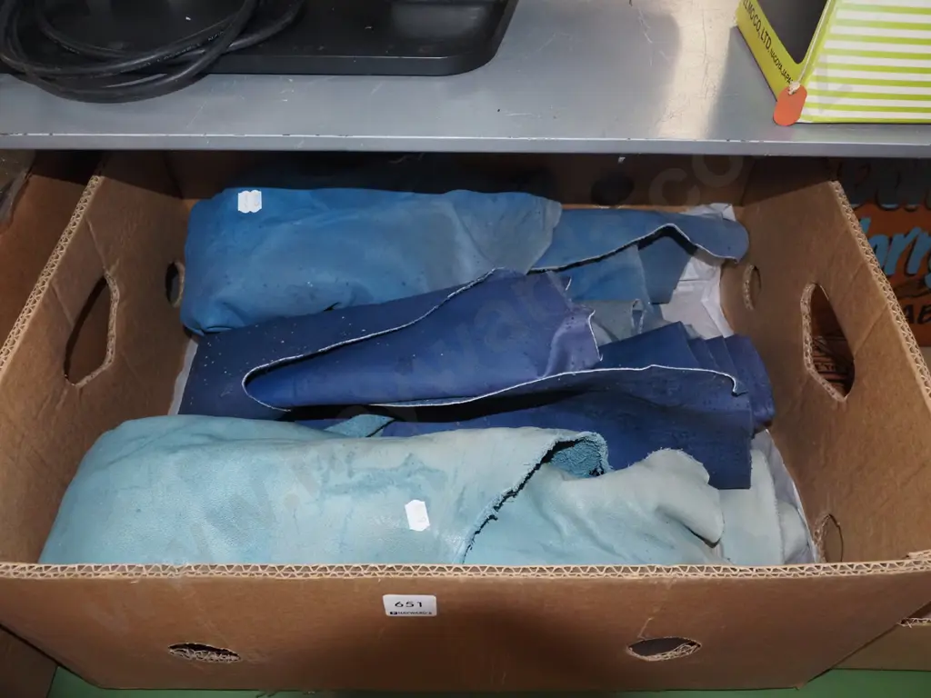 box of blue leather pieces Image 1++