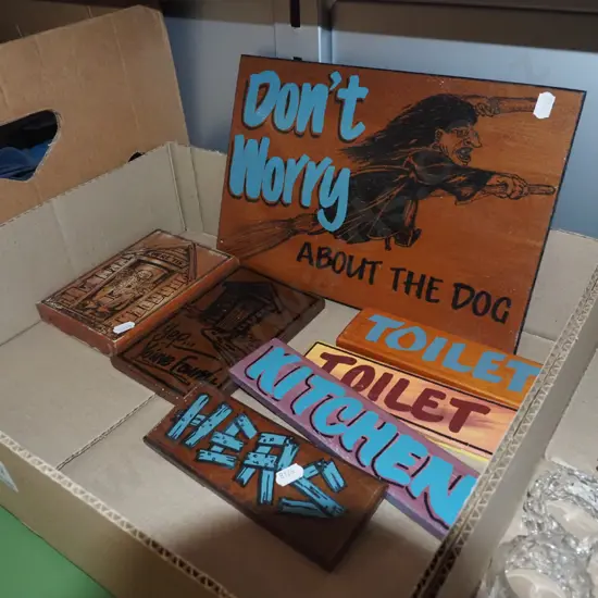 box of wooden signs