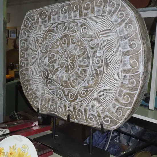 large ethnic themed carved wooden section on metal stand H-890 W-920