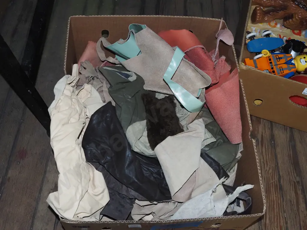 box of leather scraps Image 1++
