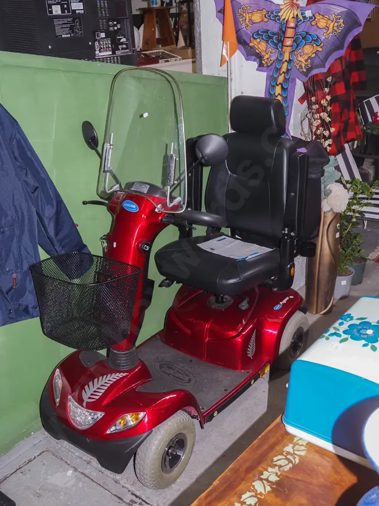 Invacare mobility scooter with shopping baskets and charger - batteries replaced 2022 Image 1++