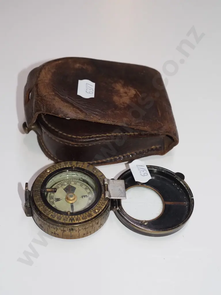 compass and leather case Image 1++