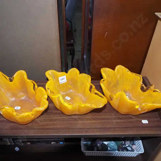 3x orange studio glass bowls