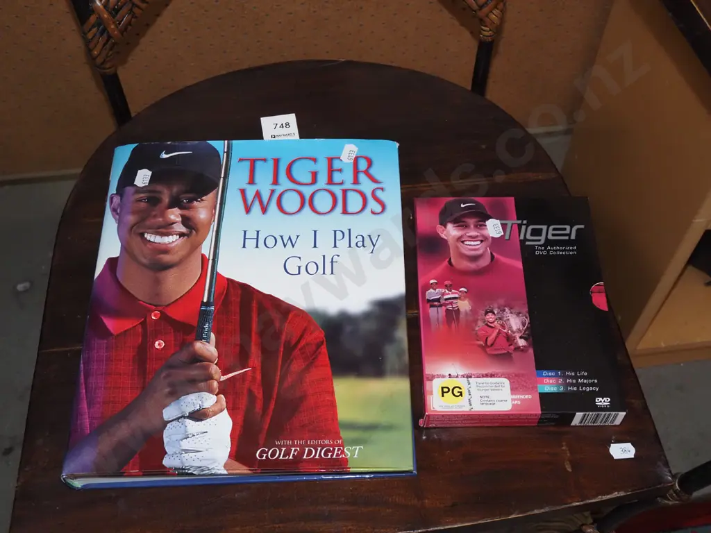 Tiger Woods DVD and books Image 1++