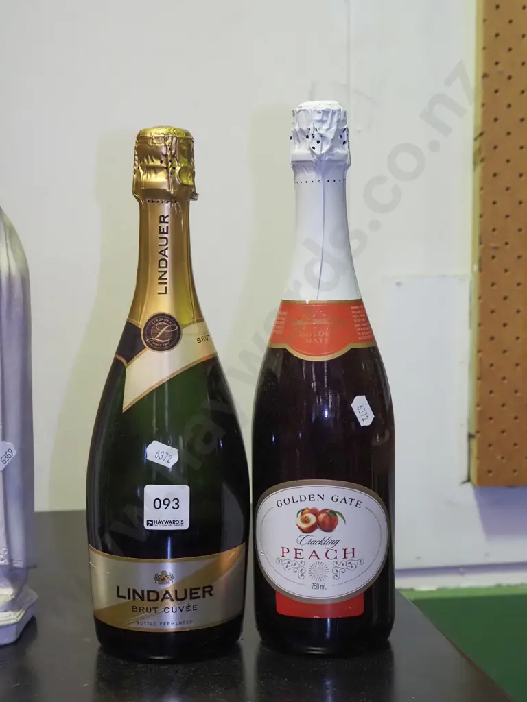 bottle of wine, bottle of sparkling peach juice Image 1++