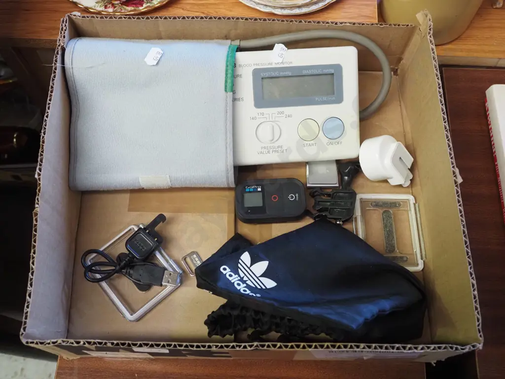 electronic blood pressure monitor,  Apple ipod, Go Pro remote control etc Image 1++