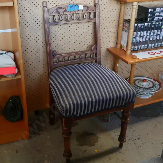 spindle back blue and grey upholstered armchair