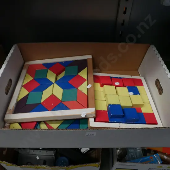 box of wooden puzzles