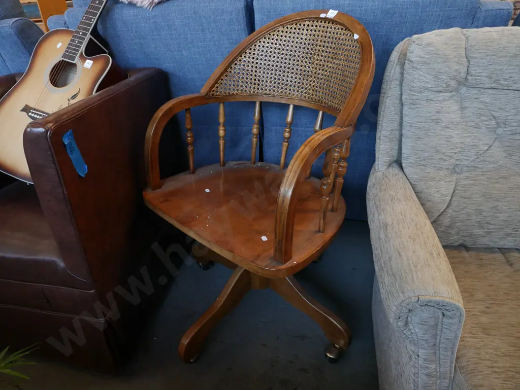 oak spindle back and rattan captain's chair on casters Image 1++