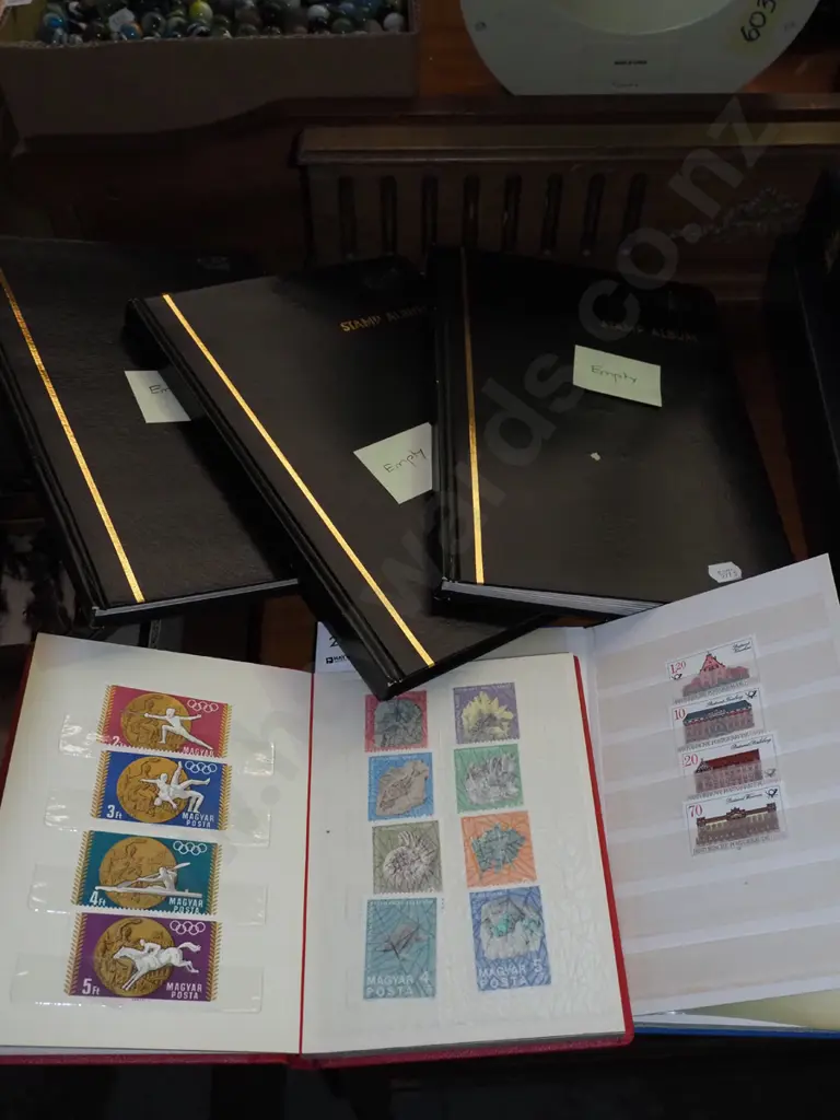 stamp albums - some empty and others light on stamps Image 1++
