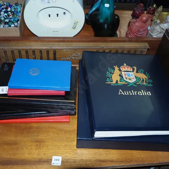 stamp albums - some empty and others light on stamps