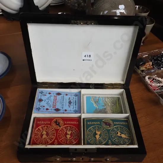 small wooden roll top box with brass crucifix on top; Bezique scorers, cards etc