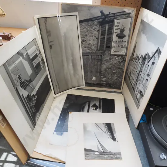 various unframed black and white photographs