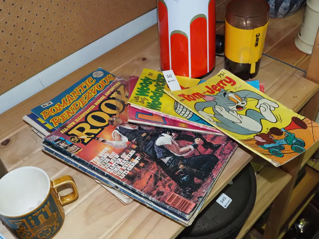 stack of comics Image 1++