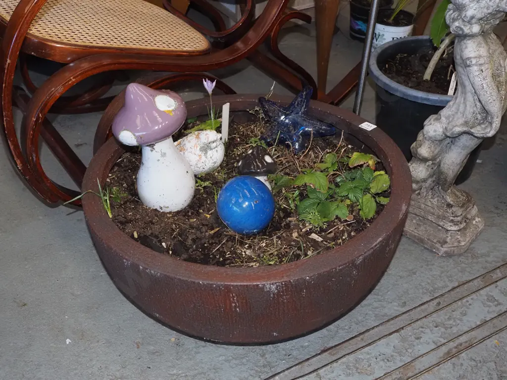 garden planter with plants and ceramic ornaments Image 1++