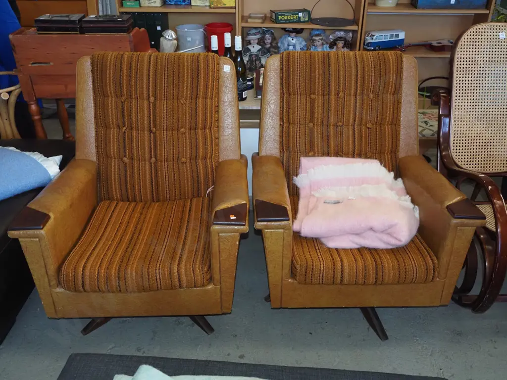 pair of retro deep buttoned fabric and vinyl upholstered swivel rocking chairs Image 1++