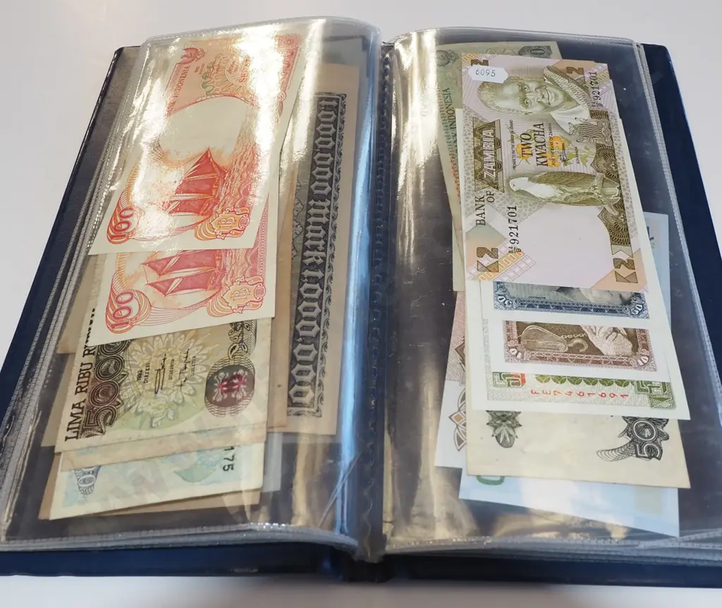 clear folder of bank notes Image 1++