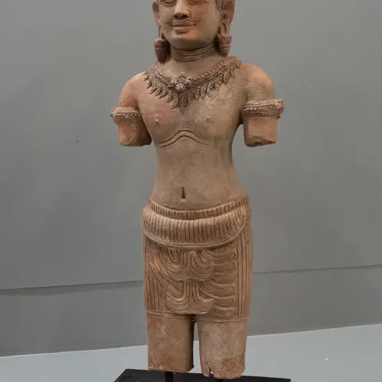 Cambodian carved sandstone figure on stand - stand needs attention - black plastic sections coming loose. H-570 W-200