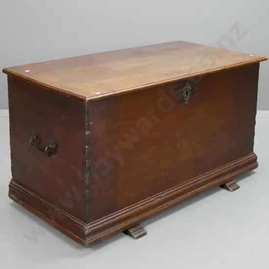 18th century oak trunk with iron carry handles and strap hinges, large iron lock with shaped escutcheon, dovetail sides,