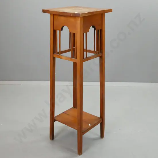 rimu art and crafts style 2-tier plant stand with arched sides and slatted gallery. Staining and deterioration to finish