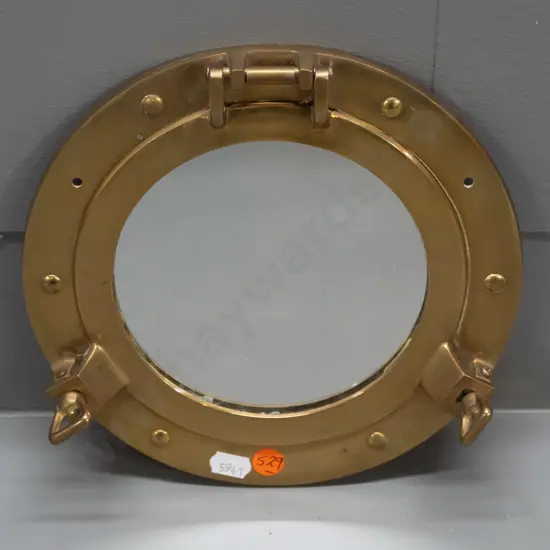 small brass porthole style wall mirror with thumb screw closures - minor discolouration D-210