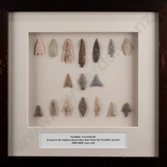 framed group of 17 neolithic stone arrowheads H-290 W-290