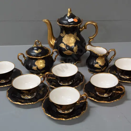 Waldershof Bavarian coffee set, heavily gilded with floral and butterfly motifs - some wear to black enamel.